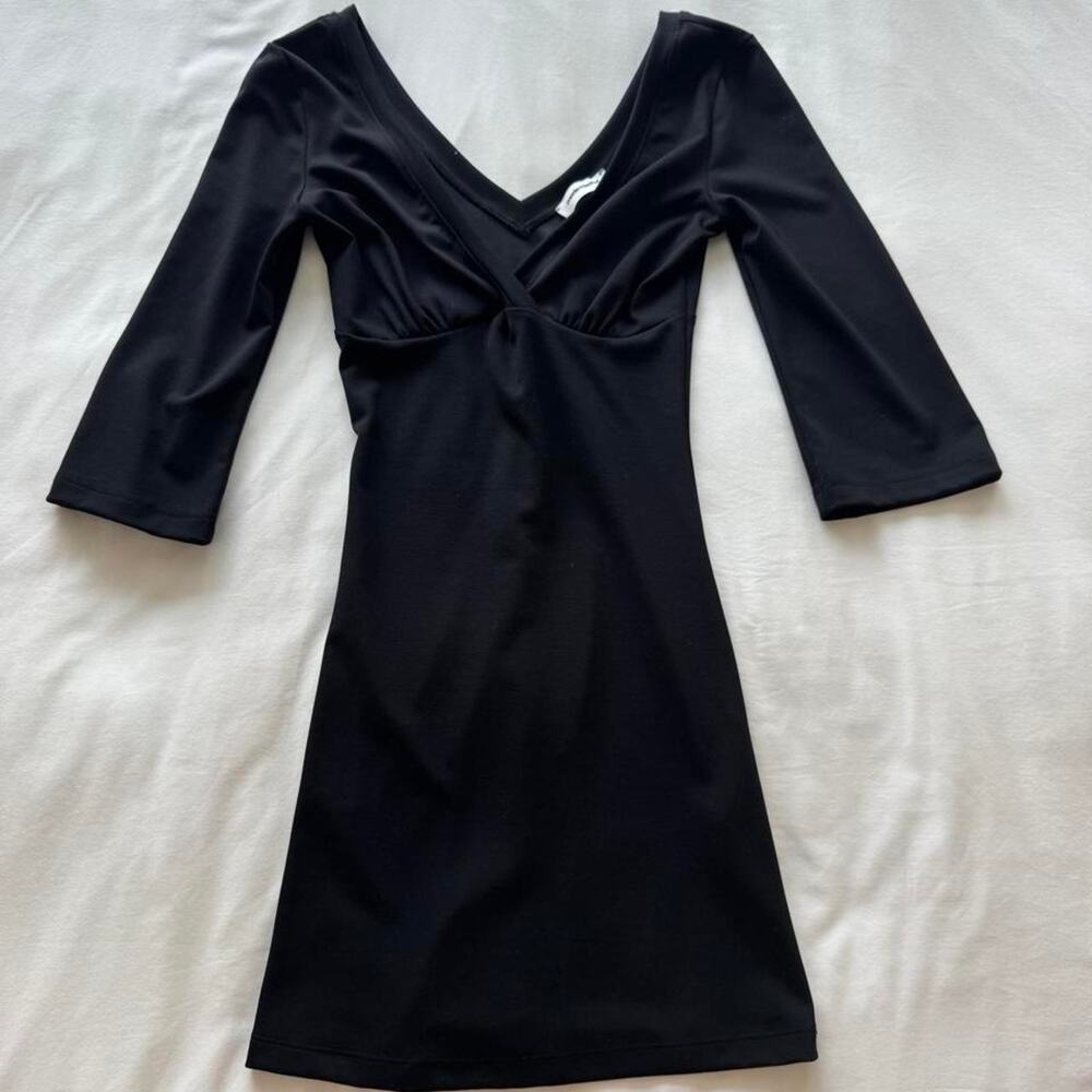 Mode mischief black long sleeve mini dress with V-neckline